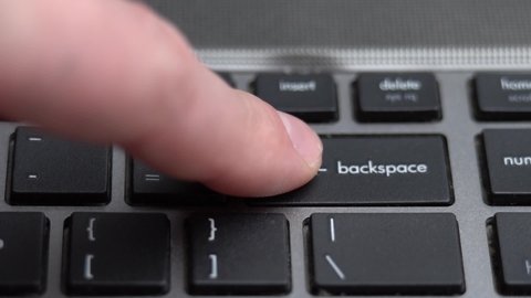 Backspace button pressing a lot of times on keyboard, laptop keyboard close up