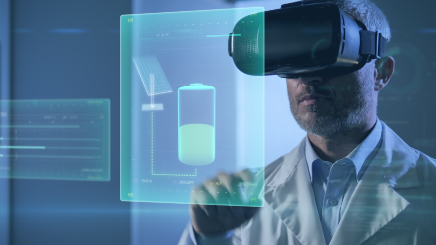 Ecological male engineer using augmented reality technology and vr glasses,renewable green energy scientist looking at virtual digital charts showing production from wind turbine,solar panels in lab | Shutterstock HD Video #1073332505