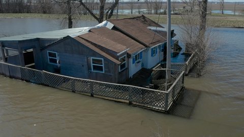 4K flood footage along Mississippi River, state of emergency. Water level high on houses. High bit rate.
