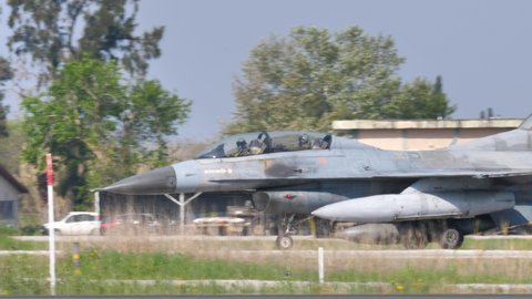 Andravida air Base Greece APRIL, 03, 2019 Lockheed Martin F-16 D two seat training version of Fighting Falcon or Viper of Hellenic Air Force taxiing with pilots in the cockpit.