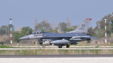 Andravida air Base Greece APRIL, 03, 2019 United States Air Force USAF grey fighter jet taxiing in profile view. Lockheed Martin F-16 C Fighting Falcon or Viper