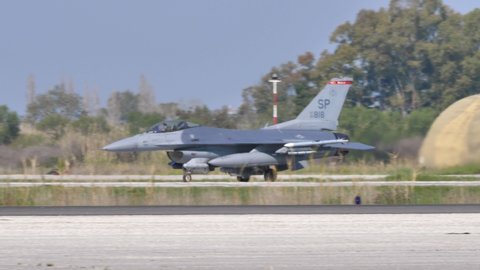 Andravida air Base Greece APRIL, 03, 2019 Lockheed Martin F-16 C Fighting Falcon or Viper of United States Air Force USAF armed with missiles and external fuel tanks taxies on military ariport