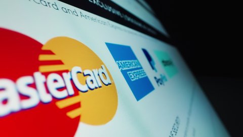 Melbourne, Australia - May 31, 2021: Motorized moving shot of logos of Visa, MasterCard, American Express, PayPal and afterpay on an online shopping website, shot with macro probe lens