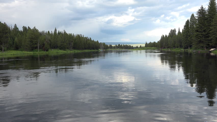 ISLAND PARK, IDAHO - JUN 2015: Island Park Henry Fork River forest 4K. Nature and major tourist and recreation destination west of Yellowstone National Park. Henrys Fork a tributary of Snake River.