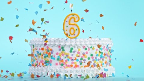 Birthday Cake With Burning Colorful Candle with Number 6 on Pastel Background. Falling confetti.
