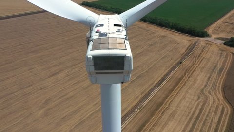 4K aerial drone view of a wind turbine. Close-up of the propeller from above. Windmill for electric power production. Green energy. Renewable energy. Cape Kaliakra.