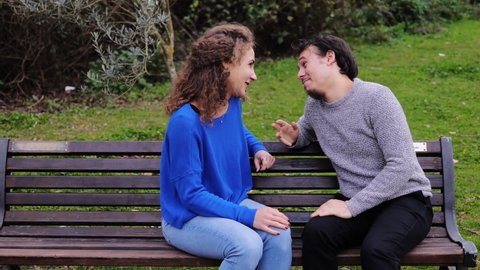 pushy friend - man talking to a girl is excluded when a pushy friend arrives