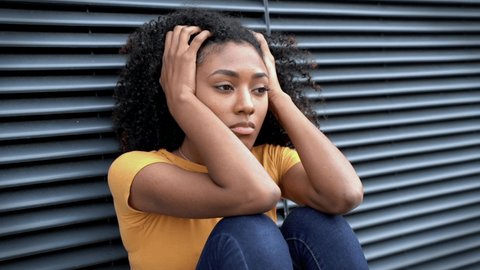 This video is about sad black girl looking away feeling alone