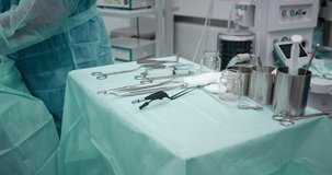 Surgical operation. Close-up of medical surgical instruments. Preparation for the operation. The medical instrument is lying on the table in the surgical room. High quality 4k video. Shot with RED.
