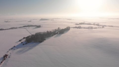 Drone shot over snowed Canadian prairies in Alberta.