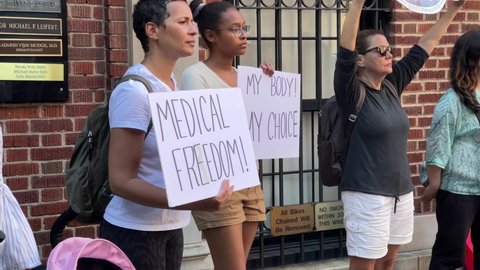 NYC, USA - MAY 29, 2021: anti-vax activists with medical freedom and my body my choice signs in New York City.