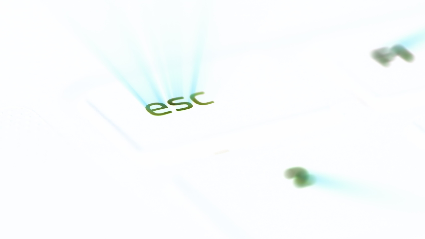 ESC escape keyboard computer key illuminated with blue rays of light - iridescent light coming from the button