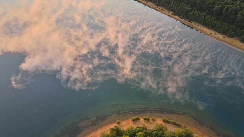 Beautiful misty idyllic lake with misty foggy autumn fall lake