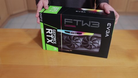 Budapest, Hungary - Circa 2021: Buying an Nvidia Geforce RTX 3090 Graphics Card made by EVGA in its box. High end GPU of the Nvidia RTX 30 series hard to get because of shortage lasting well into 2021