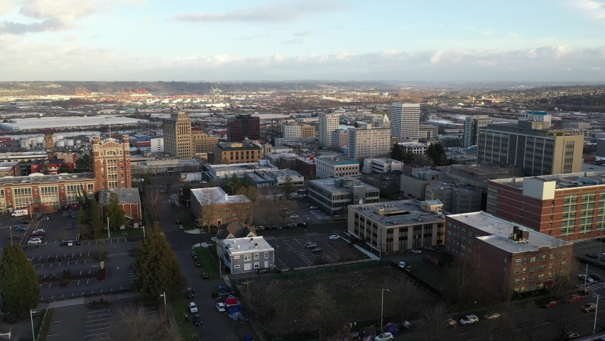 Cinematic drone shot of downtown Tacoma, harbor, dome, Commencement Bay, Puget Sound, Tacoma, a large city near Seattle in Western Washington, Pacific Northwest, economic center of Pierce County