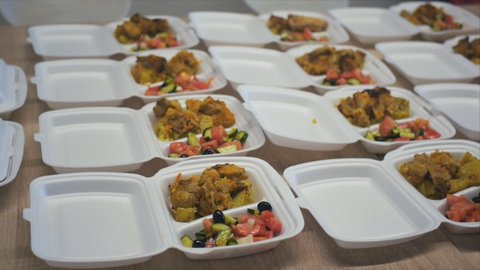 View of served plastic containers with take away meals