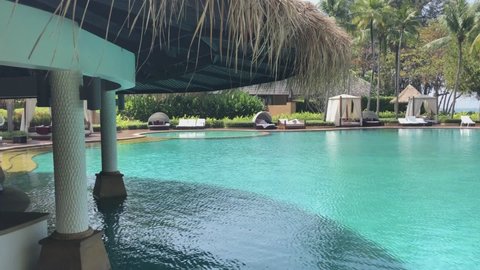 Krabi, Thailand - February 8 2018: Beachside swimming pool at luxury hotel Phulay Bay, a Ritz Carlton Reserve resort