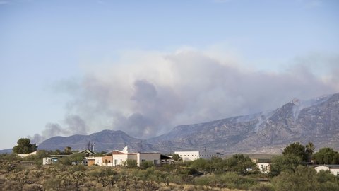 Day to Night Timelapse of Bighorn Fire, Arizona USA. Dense Smoke, Vapors, Arson on Santa Catalina Mountains and Nearby Houses, Global Warming Concept