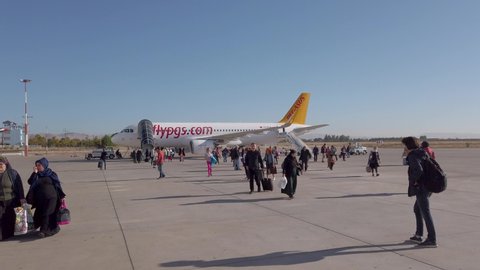 Mardin, Turkey - October 2019: Passengers just landed and walking towards Mardin Airport