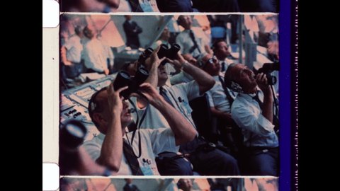 1969 Orlando, FL. NASA Men watch Apollo 11's ascent through binoculars. Mission Control Engineers at Kennedy Space Center moments after Apollo 11 Launch.  4K Overscan Vintage Archival 16mm Film Print