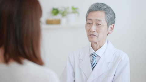Image of an elderly male doctor