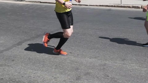 Chelyabinsk, Russia - May 30, 2021: male runner in Nike shoes running on asphalt during Race-2021