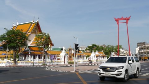 BANGKOK, THAILAND - 11 JULY, 2019: Giant Swing religios historic monument near traditional wat Suthat buddist temple. Iconic city view, cultural symbol. Famous landmark and classic tourist attraction