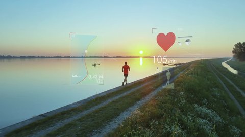 Virtual fitness tracker concept, runner at sunrise using futuristic health app