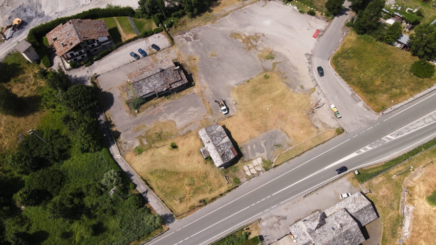 Top Down View Over An Abandoned Area In The Mountain Near Main Road With Vehicles Passing In Morgex, Val D