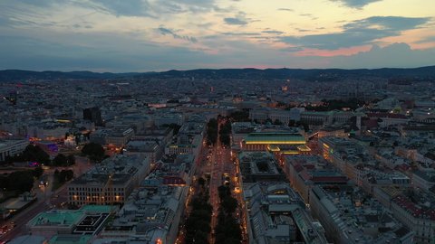 sunset sky night illuminated vienna city center opera house traffic street aerial panorama 4k austria
