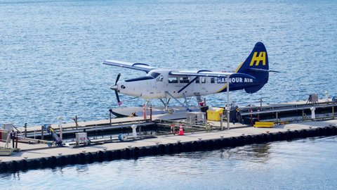 A seaplane parked and docked at the Coal Harbour, Vancouver, Canada, May 2021