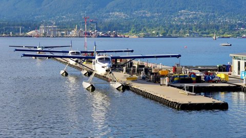 Seaplanes parked and docked at the Coal Harbour, Vancouver, Canada, May 2021