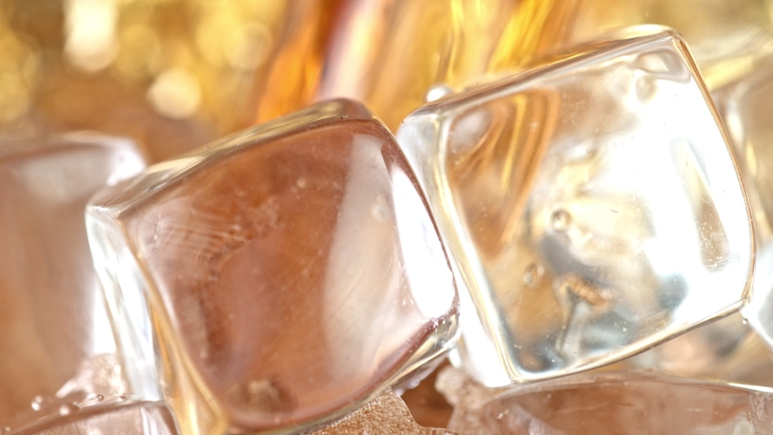 Super Slow Motion Detail Shot of Pouring Cola Lemonade into Glass with Ice Cubes at 1000 fps. Royalty-Free Stock Footage #1073486771