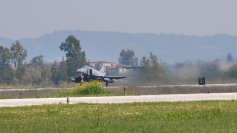 Andravida Greece APRIL, 03, 2019 Tandem two-seat, twin-engine, all-weather, long-range supersonic jet interceptor and fighter-bomber takes off. McDonnell Douglas F-4E Phantom II of Hellenic Air Force