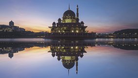 Beautiful sunrise time Lapse at Putra mosque by a lake in Putrajaya, Malaysia at dawn. Zoom out motion timelapse. Prores Full HD