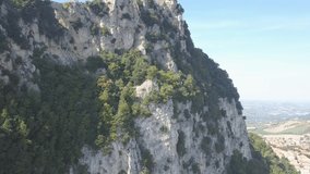 drone flying around the san marino towers at the top of the mountain  in Italy