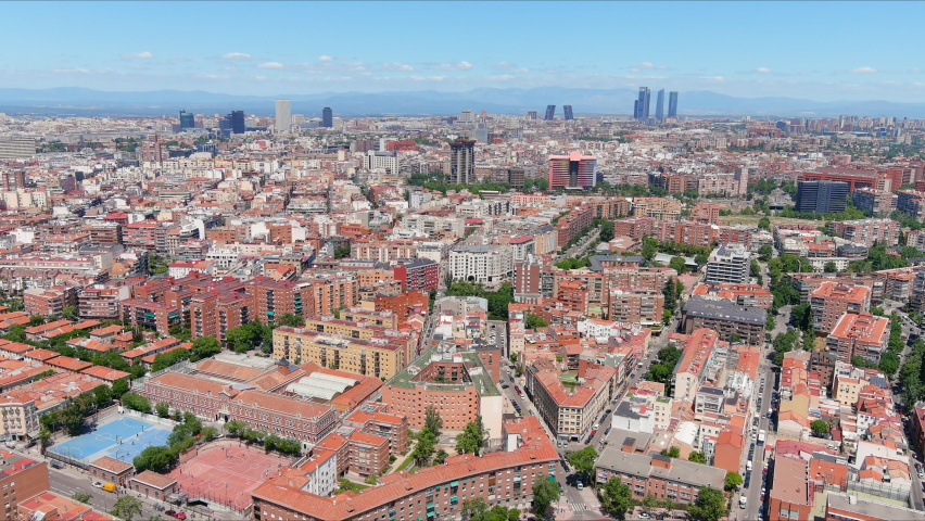 Madrid: Aerial view of capital city of Spain, modern office buildings (skyscrapers) skyline in background - landscape panorama of Europe from above Royalty-Free Stock Footage #1073492261