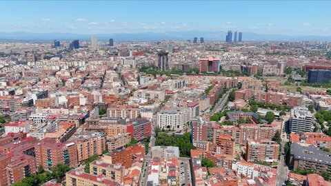 Madrid: Aerial view of capital city of Spain, modern office buildings (skyscrapers) skyline in background - landscape panorama of Europe from above