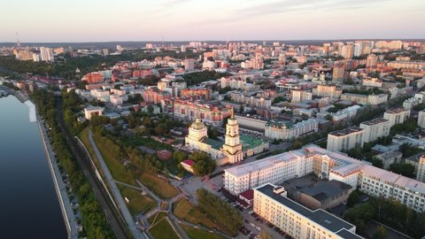 Aerial drone view of Perm city, art gallery and long street in the city centre in sunny summer day in the sunset
