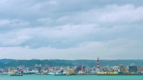 Kagoshima, Japan. View of  Kagoshima city in Japan during a cloudy day. Time-lapse with moving clouds
