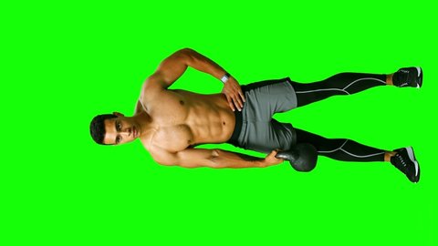 Sporty young man working out with a kettlebell. Full length. Alpha channel. See other exercises. Vertical footage