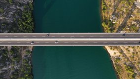 Aerial view on bridge. Highway above sea. View from a drone. Natural landscape in summer time from air. Travel and vacation. Transportation video