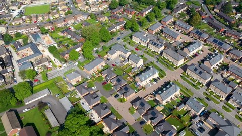 Aerial footage of the British town of Harrogate, a town in North Yorkshire, England, east of the Yorkshire Dales National Park in the summer time showing residential housing estates