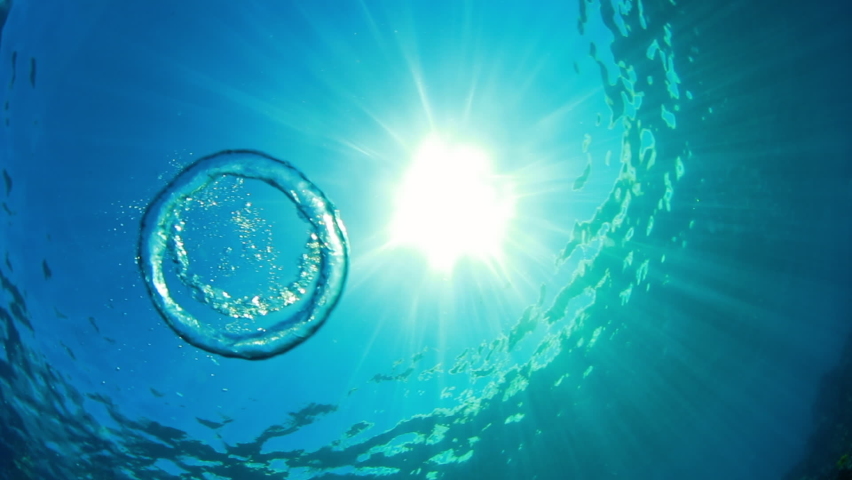 Close-Up Shot Of Water Rings Underwater, Sunlight Falling In Sea - Big Island, Hawaii Royalty-Free Stock Footage #1073513573