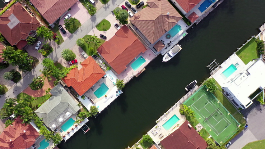 Aerial Top Downward Shot Of Canals Flowing Between Houses In City, Drone Flying Over Boats - Miami, Florida