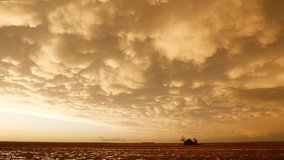 A Vivid Sunset Illuminates Mammatus Clouds Over An Abandoned Farmhouse After A Severe Storm Outbreak in Tornado Alley - Powered by Shutterstock - Get 15% off with code: PIKWIZARD15
