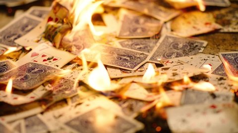 Playing cards inside bonfire .
Cards burning on the floor . This clip is perfect for projects about casino or fall of a business or empire. Shot on ARRI cinema camera in Slow Motion