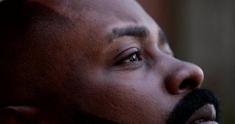 Worried black man close-up face. Anxious African guy