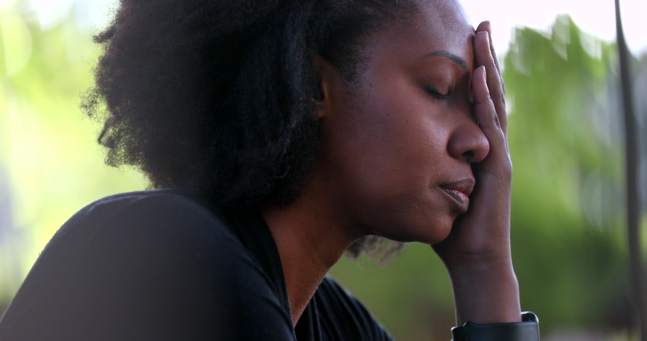 Preoccupied black woman feeling stress and pressure. African person suffering | Shutterstock HD Video #1073535191