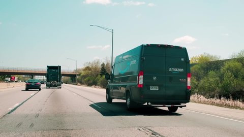 USA. Chicago MAY 2, 2021 An Amazon Prime van goes down highway in Chicago city. Amazon is launching its own delivery service to competet